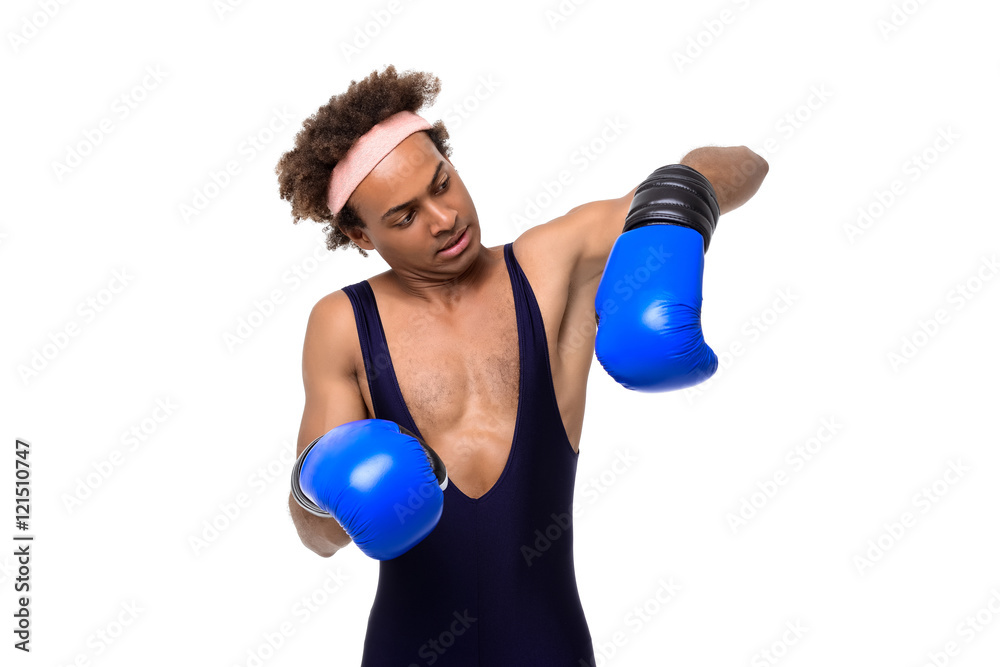 Sportive african man in boxing gloves posing over white background. Sportive african man in boxing gloves posing over white background.