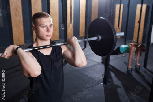 functional fitness workout at the gym with barbell