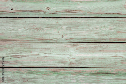 faded green painted aged wooden background with paint peeling
