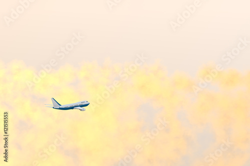 Airplane Flying in Sunset