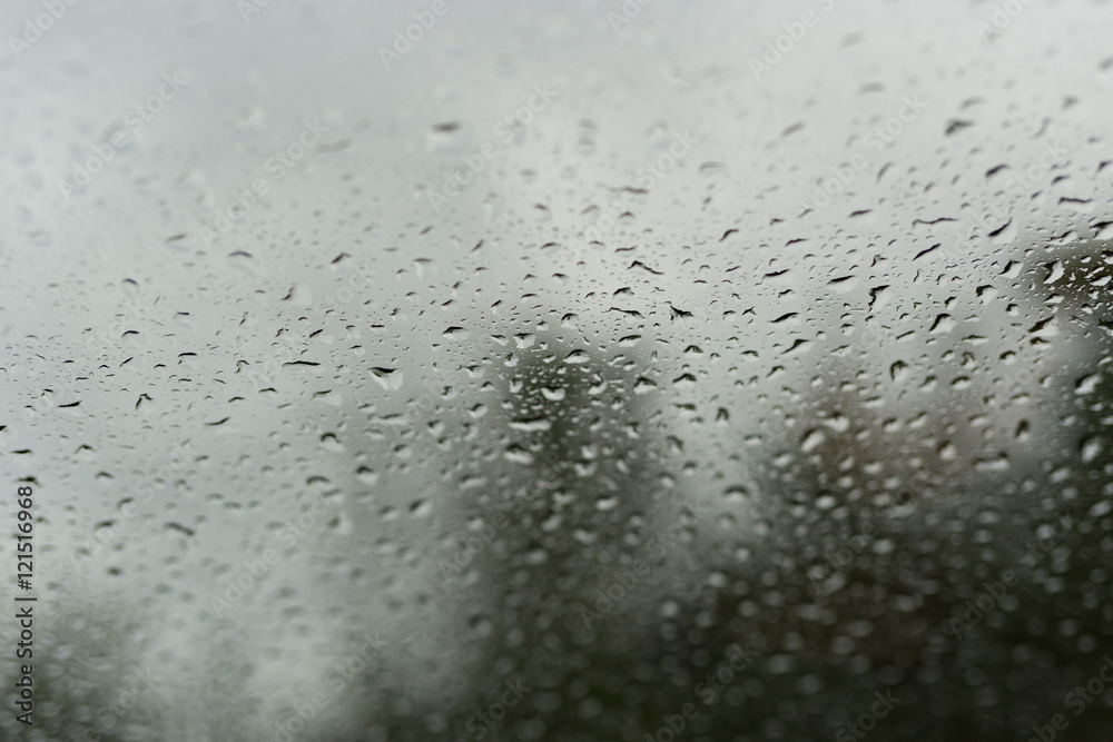 Drops of rain on glass , rain drops on clear window Drops of rain on glass , rain drops on clear window