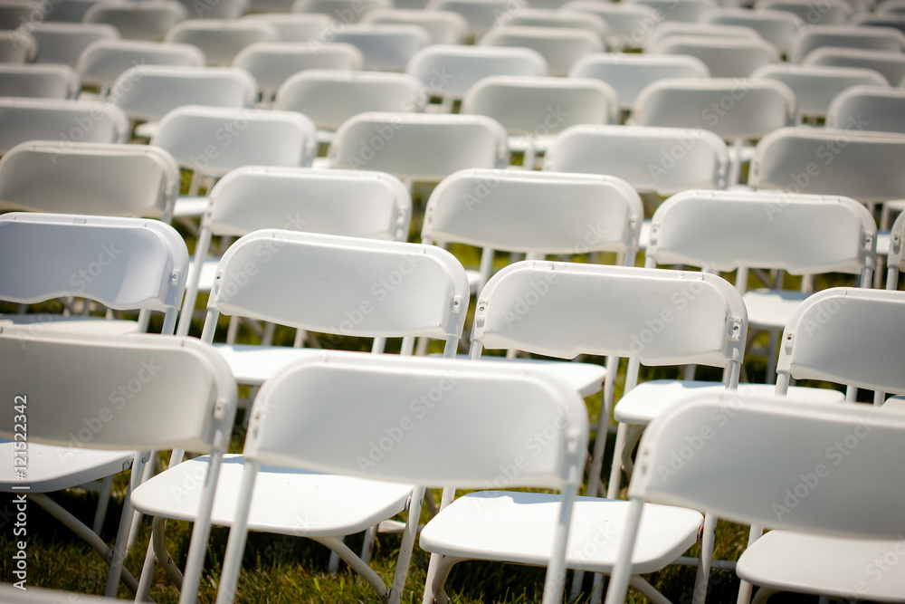 Fototapeta premium Rows of Empty White chairs