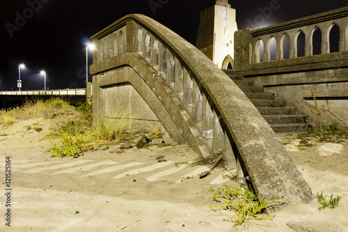Stairway leading into beach sand at night © Stewart