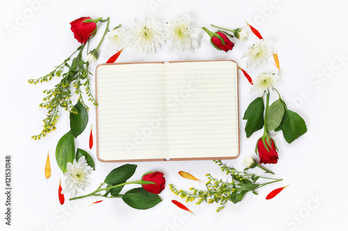Fototapeta Naklejka Na Ścianę i Meble -  Top view of beautiful flowers and open blank notebook