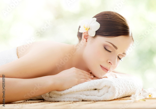 Young and beautiful girl relaxing in a spa salon