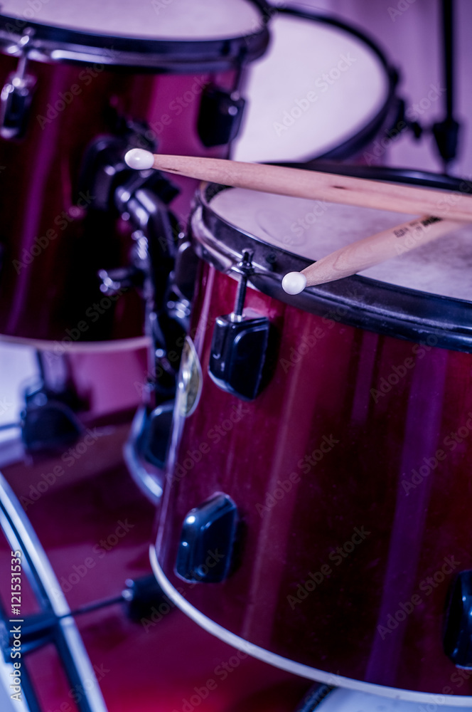 Obraz premium Drums conceptual image. Picture of drums and drumsticks lying on snare drum.