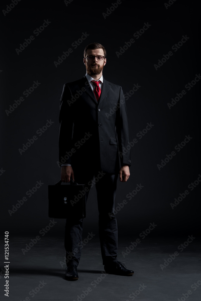 Businessman on a black background Businessman on a black background