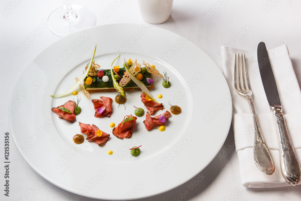 High French cuisine. Slices of roast beef with sauce and millefe High French cuisine. Slices of roast beef with sauce and millefe