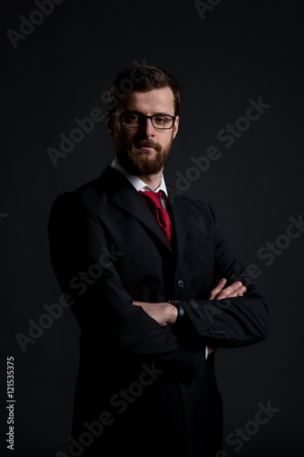 Portrait of a businessman on a black background