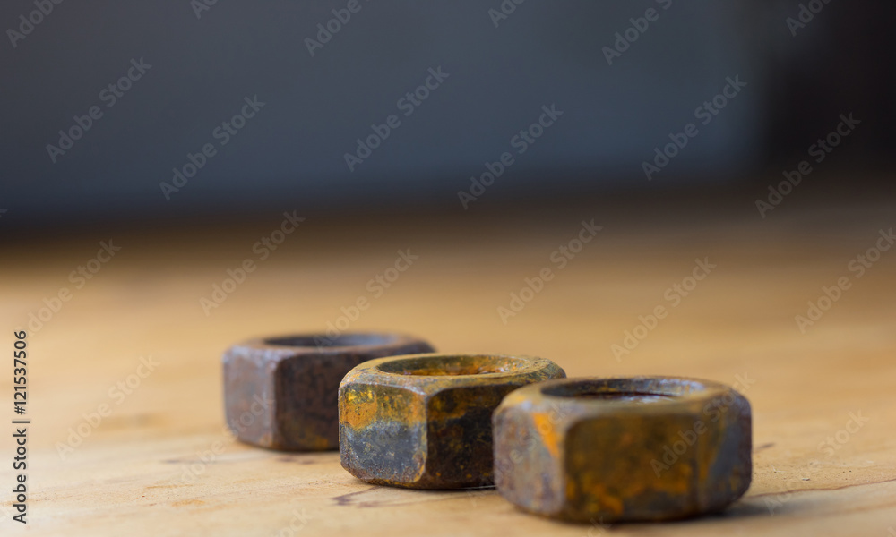 Industrial bolts and nuts with shallow focus Industrial bolts and nuts with shallow focus