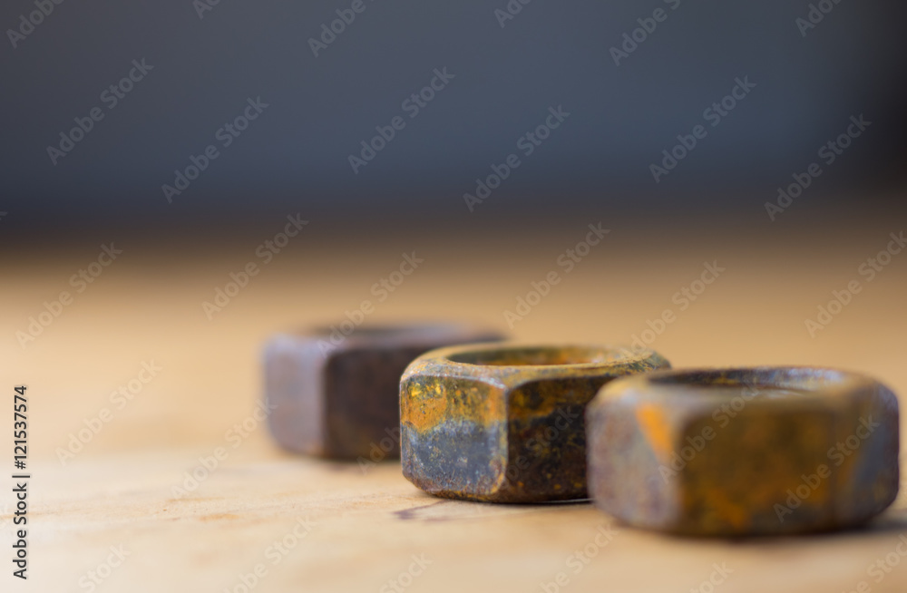 Industrial bolts and nuts with shallow focus