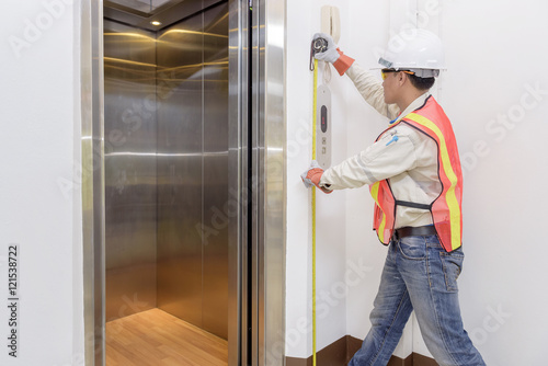 Technician - Engineer investigate work adjustment mechanism lift