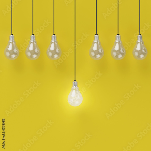Creative light bulb Idea concept on yellow background