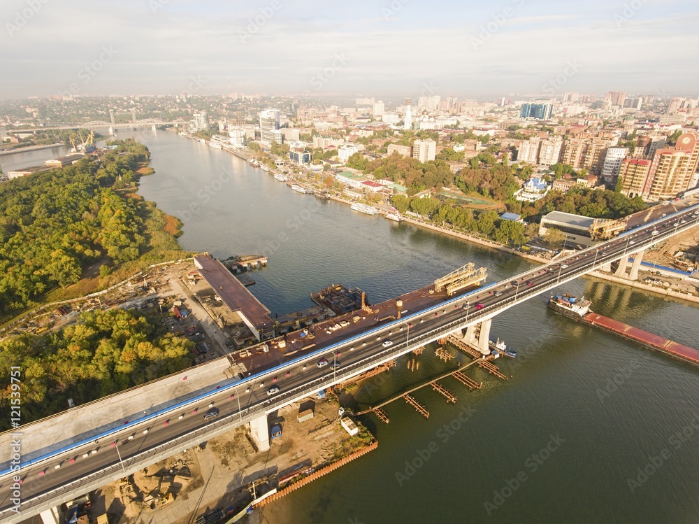 Construction of the bridge across the river.  Aerial view.