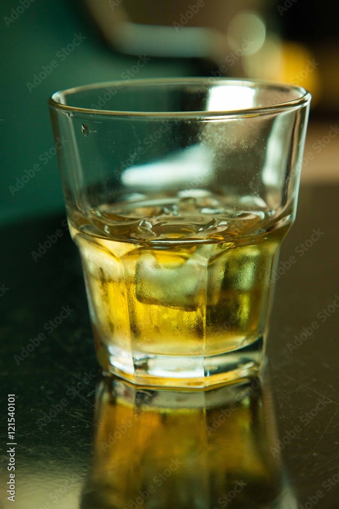 Glass of whiskey with ice Glass of whiskey with ice