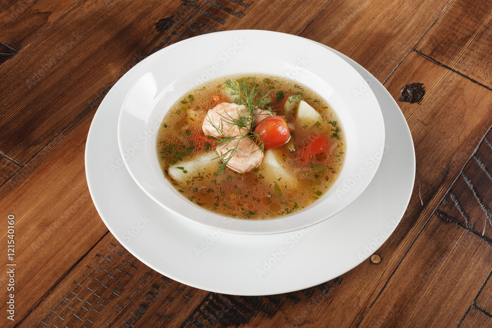 Chobra - traditional middle eastern soup in a white plate. Wooden background. Chobra - traditional middle eastern soup in a white plate. Wooden background.