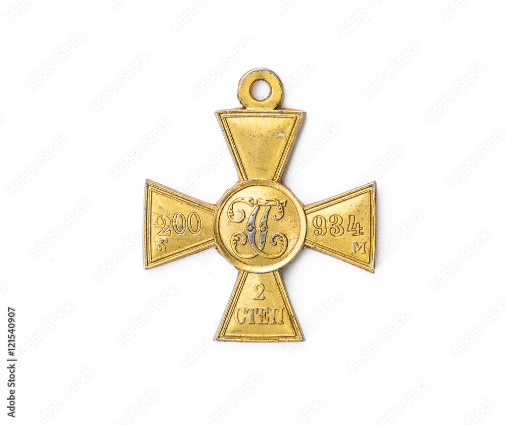 Naklejka premium old Russian medal in the shape of a cross on a white background