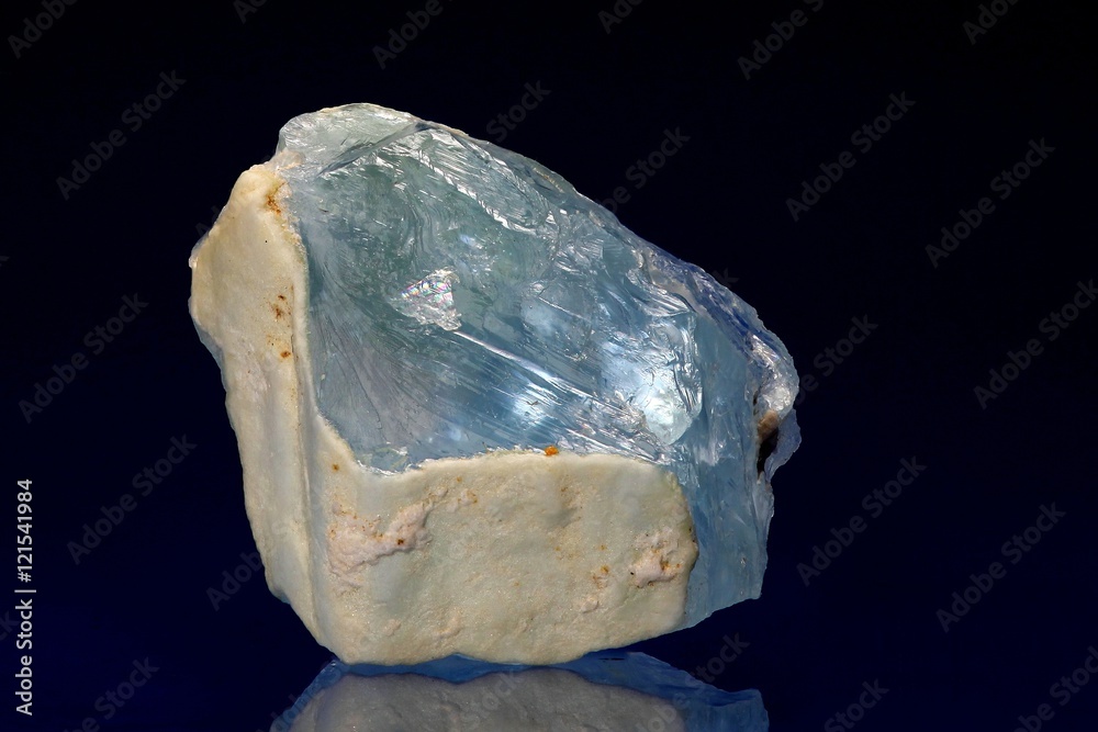 Gem quality crystal of blue topaz.  Sample from Viitaniemi feldspar quarry, Finland.