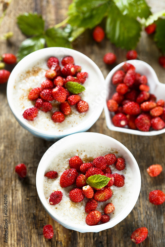 Rice pudding or Milchreis with wild strawberry