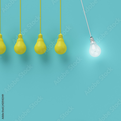 Hanging yellow light bulbs with glowing one different idea on light blue background , Minimal concept idea , flat lay , top