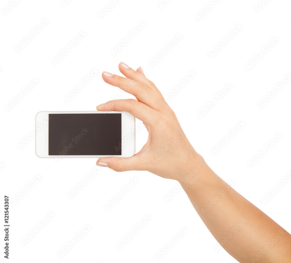 Female hand showing smartphone of white screen, front view, isolated. Female hand showing smartphone of white screen, front view, isolated.