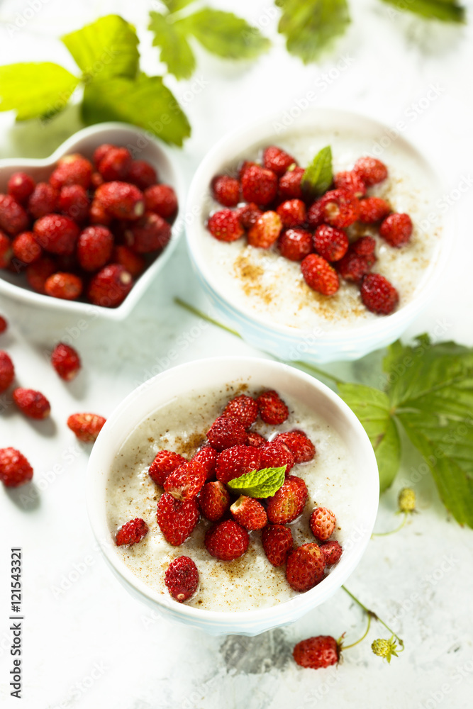Rice pudding or Milchreis with wild strawberry Rice pudding or Milchreis with wild strawberry