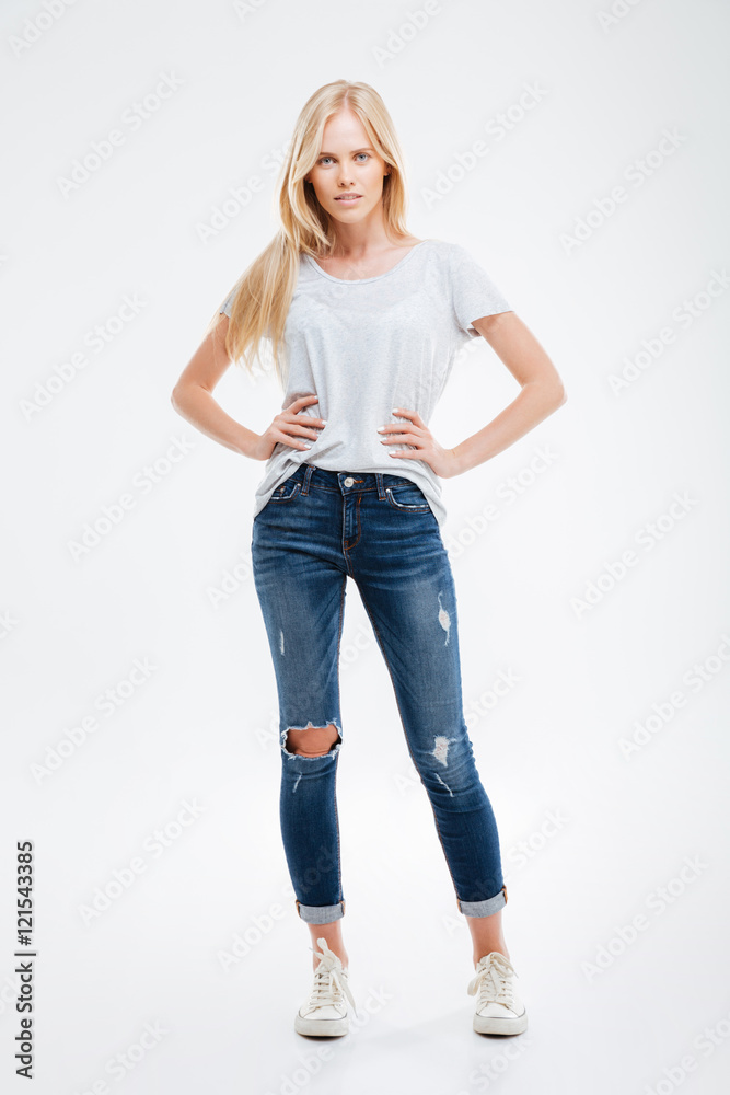 Beautiful smiling girl with her arms on hips Beautiful smiling girl with her arms on hips