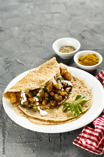 Indian pancakes with potato and spices photo