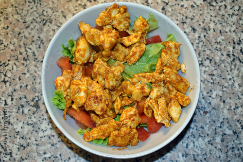 Delicious homemade spicy and healthy chicken salad  for recovery after workout.