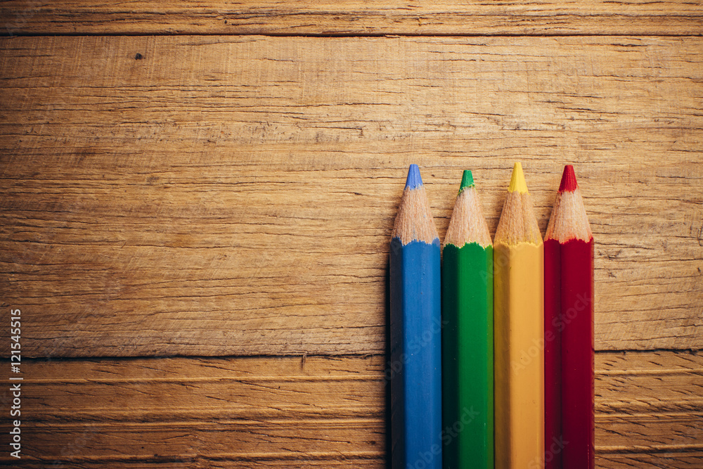Crayons pencils on wooden background Crayons pencils on wooden background