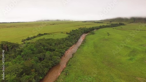 Fying over the Okoine river in the Kamarata Valley at Uruyen. Auyan Tepui at the background. La Gran Sabana, Venezuela