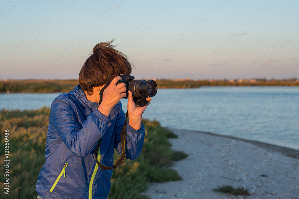 Active woman with camera
