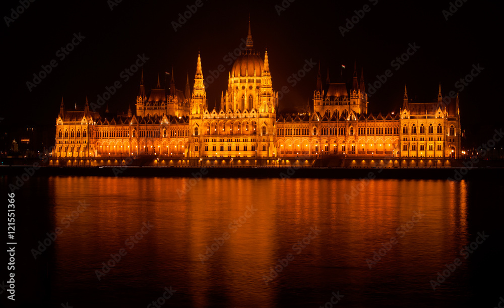 Hungarian parliament building by night isolated and illuminated across the Danube river, Budapest, Hungary