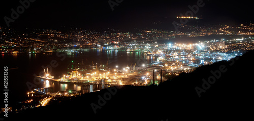 The bay of Novorossiysk by night with an illuminated port and city, Russia