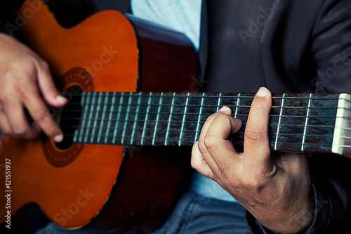 closeup playing the guitar vintage effect.