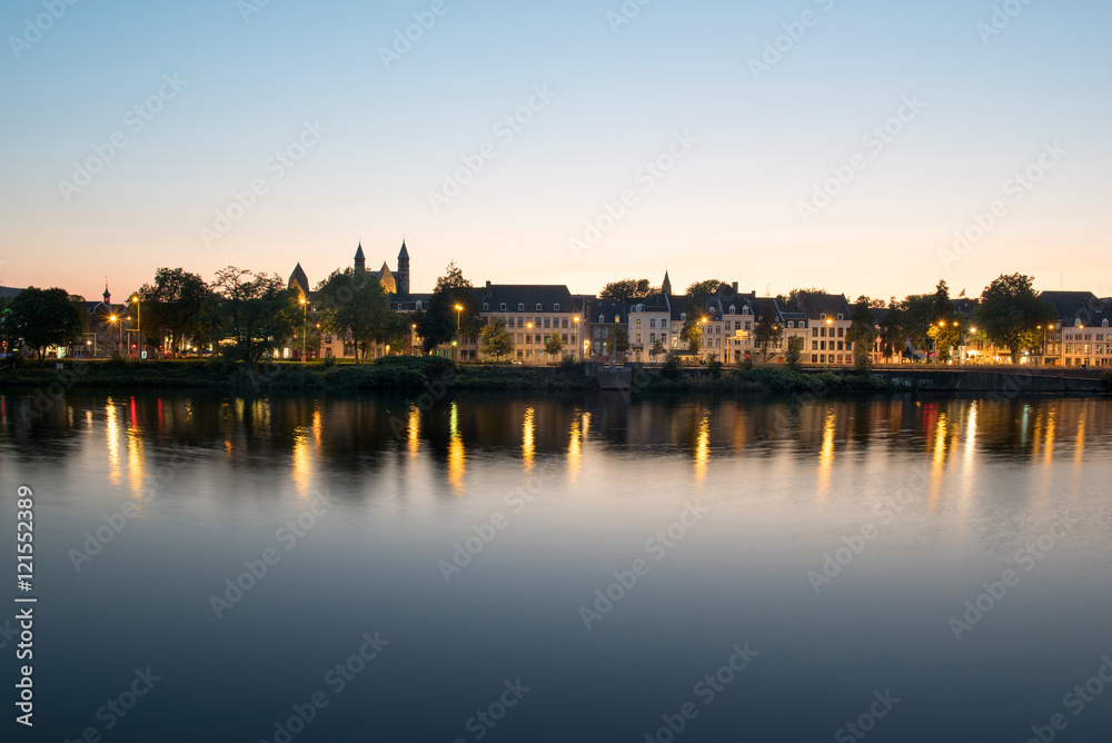 Maastricht across the river during sunset