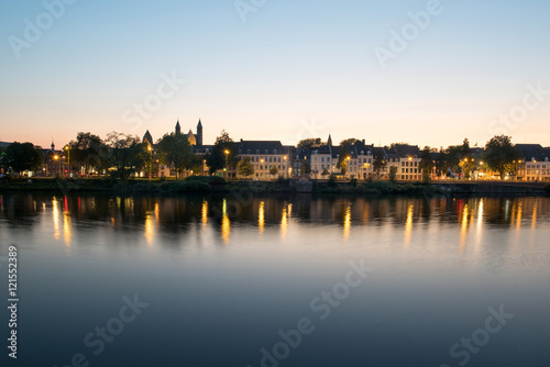 Maastricht across the river during sunset