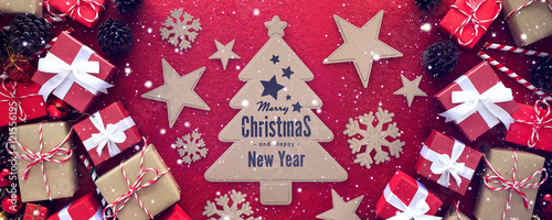 merry christmas gift box with white ribbon on red velvet background. over light  © memorystockphoto