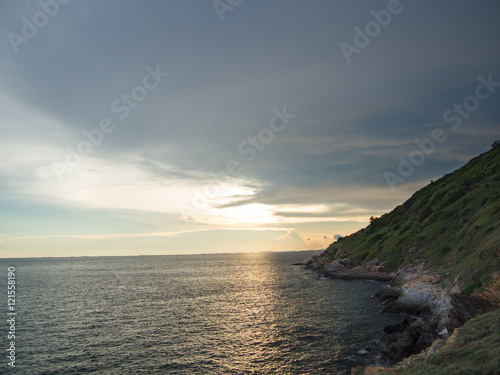 sunset on the sea and mountain at khao leam ya samed island in Thailand.