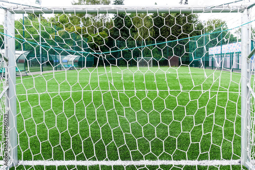 Football field through gate