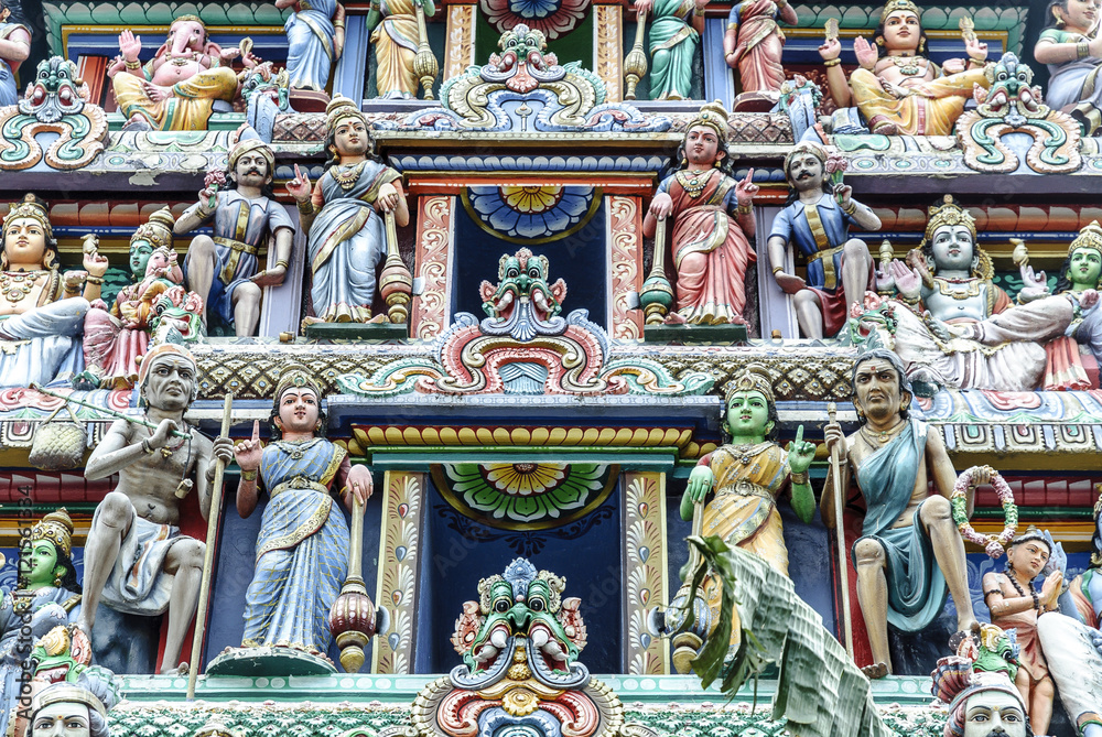 sculptures of gods and goddesses in the gopura of entry to the temple The Sri Mariamman Temple in Singapore