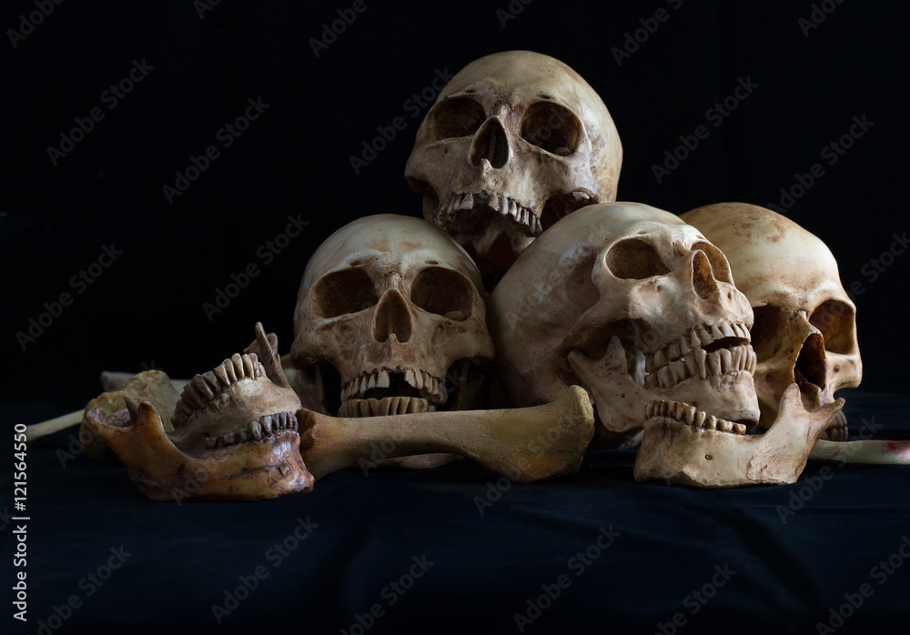 Awesome pile of skull and bone on black cloth
