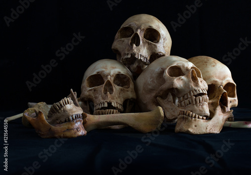 Awesome pile of skull and bone on black cloth