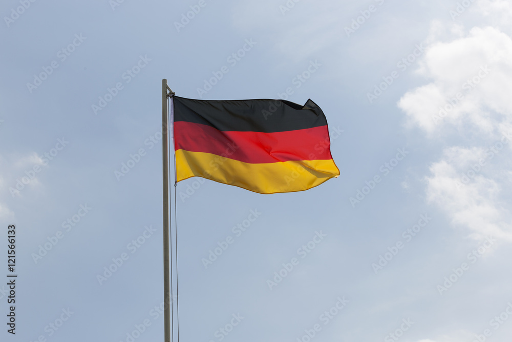 National flag of Germany on a flagpole National flag of Germany on a flagpole