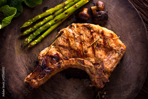 Grilled pork chops and asparagus. photo