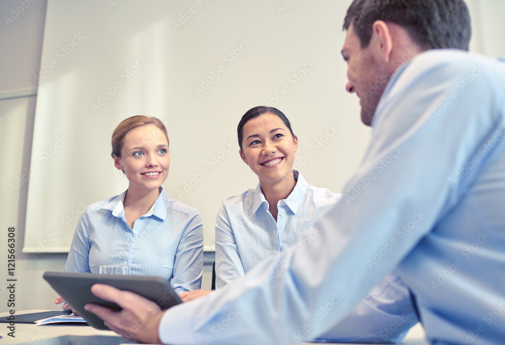 smiling businesspeople with tablet pc in office smiling businesspeople with tablet pc in office