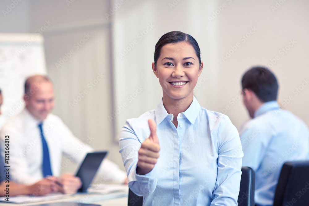 group of smiling businesspeople meeting in office group of smiling businesspeople meeting in office