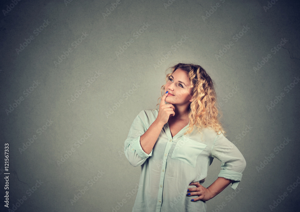 Happy woman thinking looking up Happy woman thinking looking up