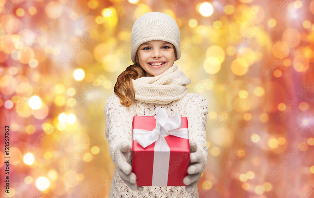 happy girl in hat, scarf and gloves with gift box happy girl in hat, scarf and gloves with gift box