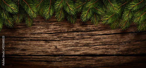 Christmas wooden background with fir branches